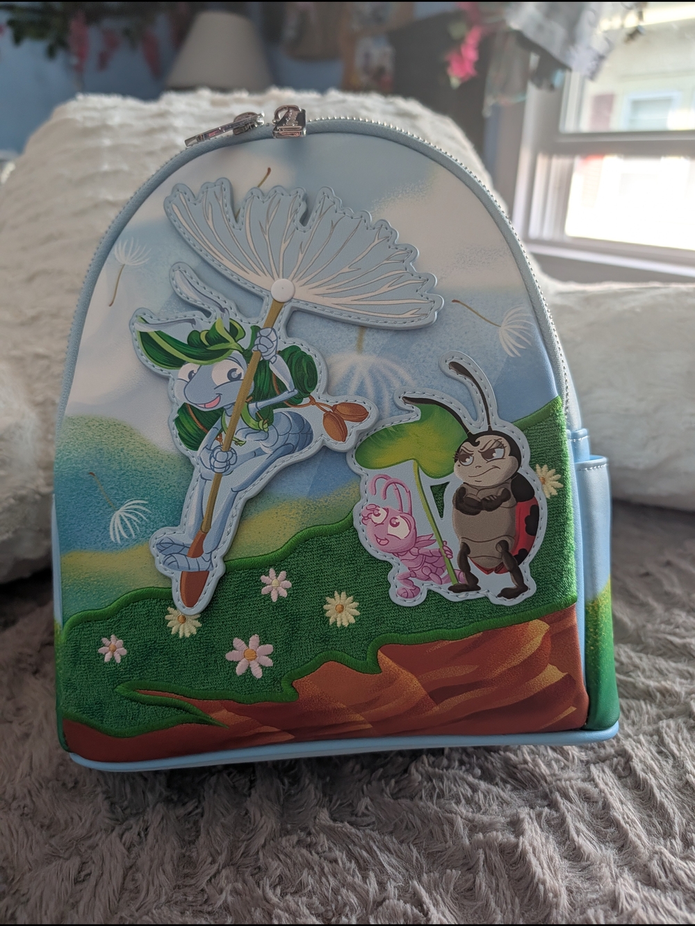 Loungefly Light Blue Kids Mini Backpack with Playful Nature Characters